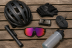 Essential cycling kit arranged on a bench with helmet and gloves